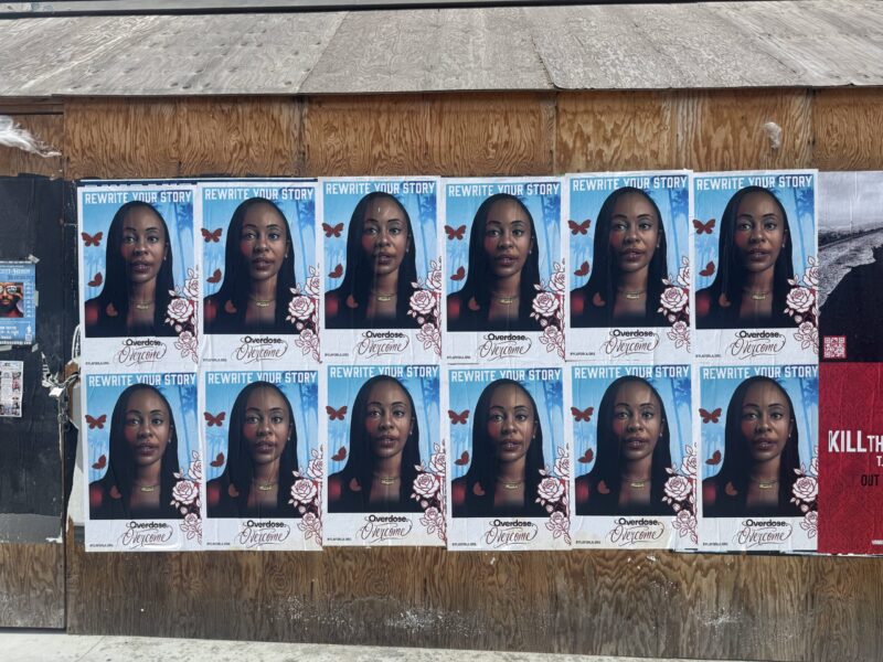 Wheatpaste street art overdose awareness posters on plywood hoarding, Leimert Park, Los Angeles, 2026