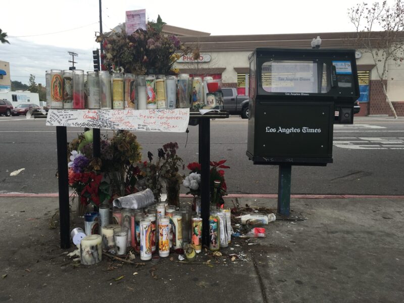 Roadside memorial with vigil candles and framed poem on North Figueroa Street, Los Angeles, 2016