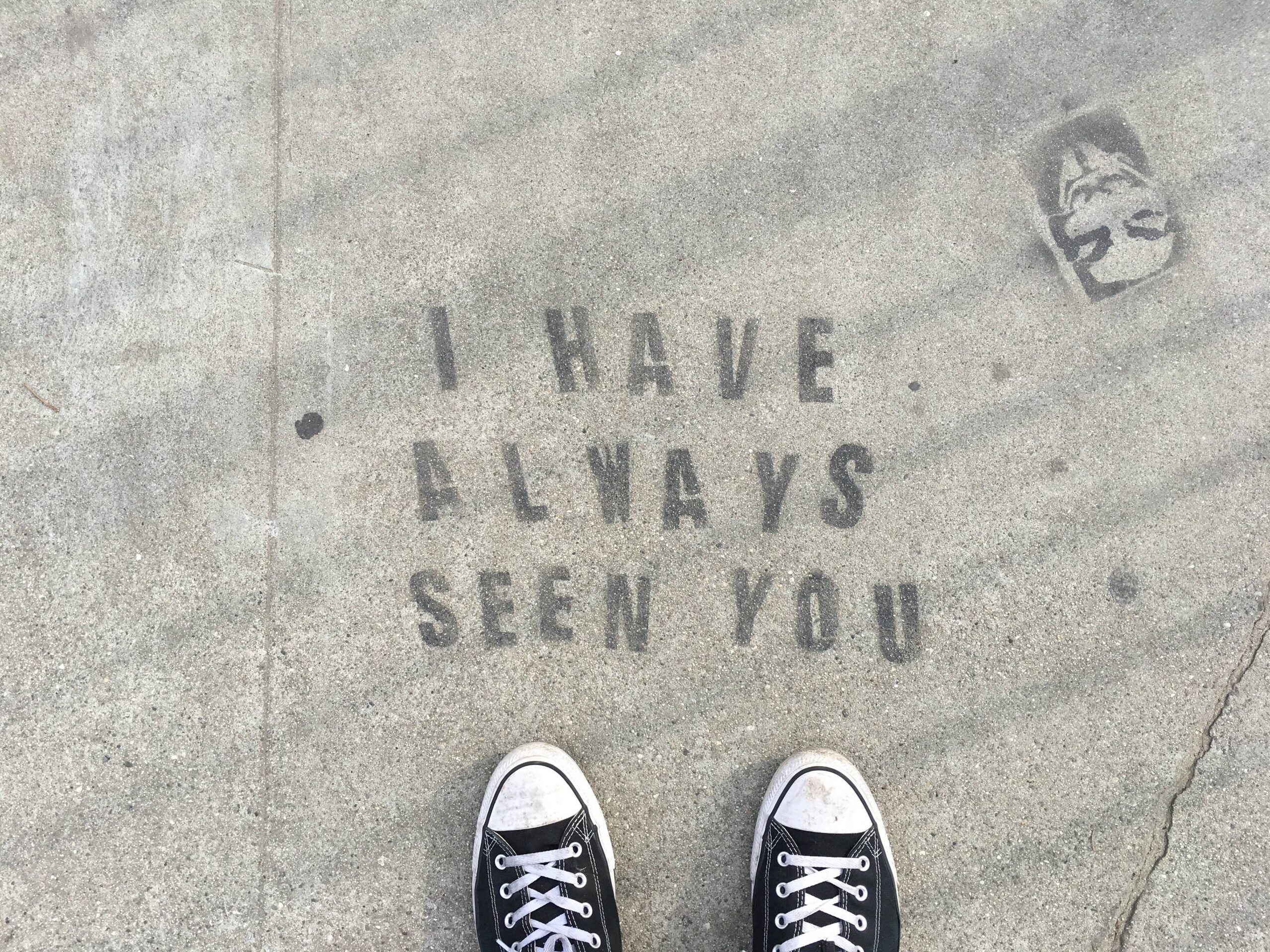 Anonymous stencil street art on Traction Avenue sidewalk, Los Angeles, 2016