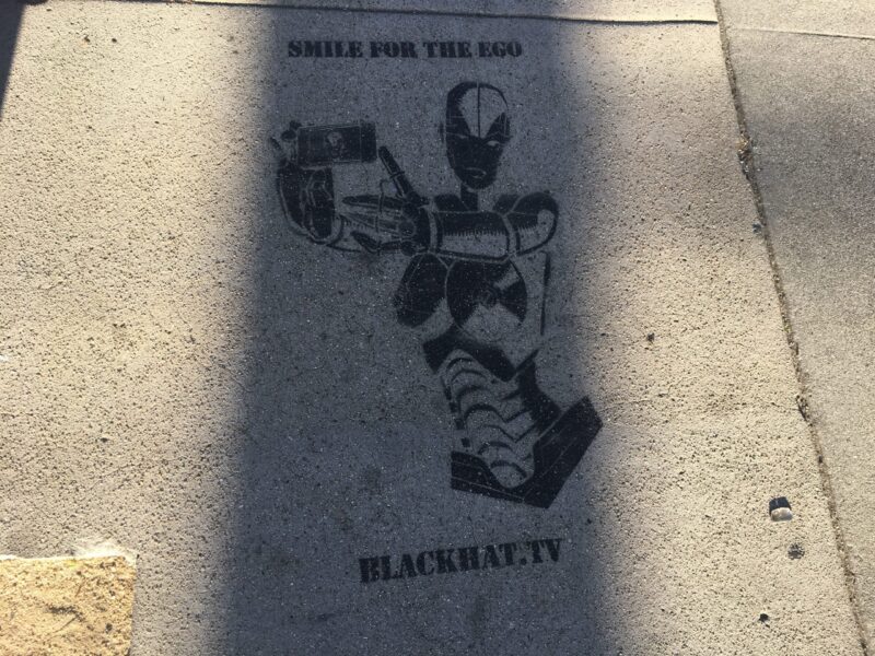 Black stencil street art on concrete sidewalk, Traction Avenue, Los Angeles, 2016